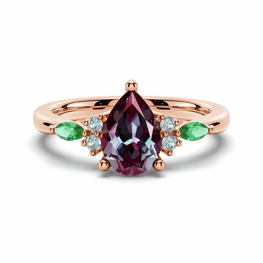 gentle touch 1.5 CT. Pear Shaped Alexandrite Engagement Ring With Emerald Accents
