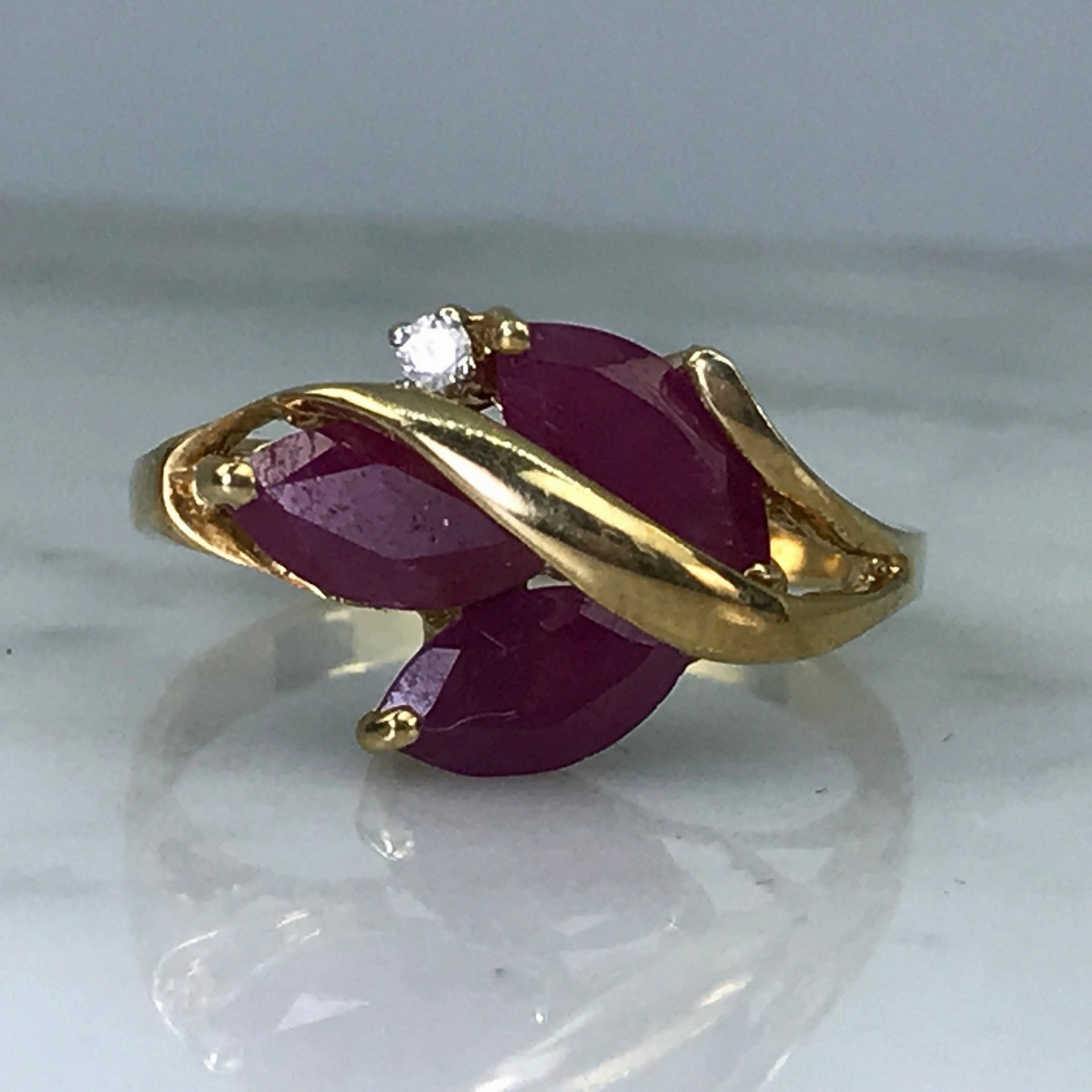 Iconic Appeal Ruby Diamond Cluster Ring in 10K Gold. July Birthstone. 15th Anniversary. 1970s. Size 7.