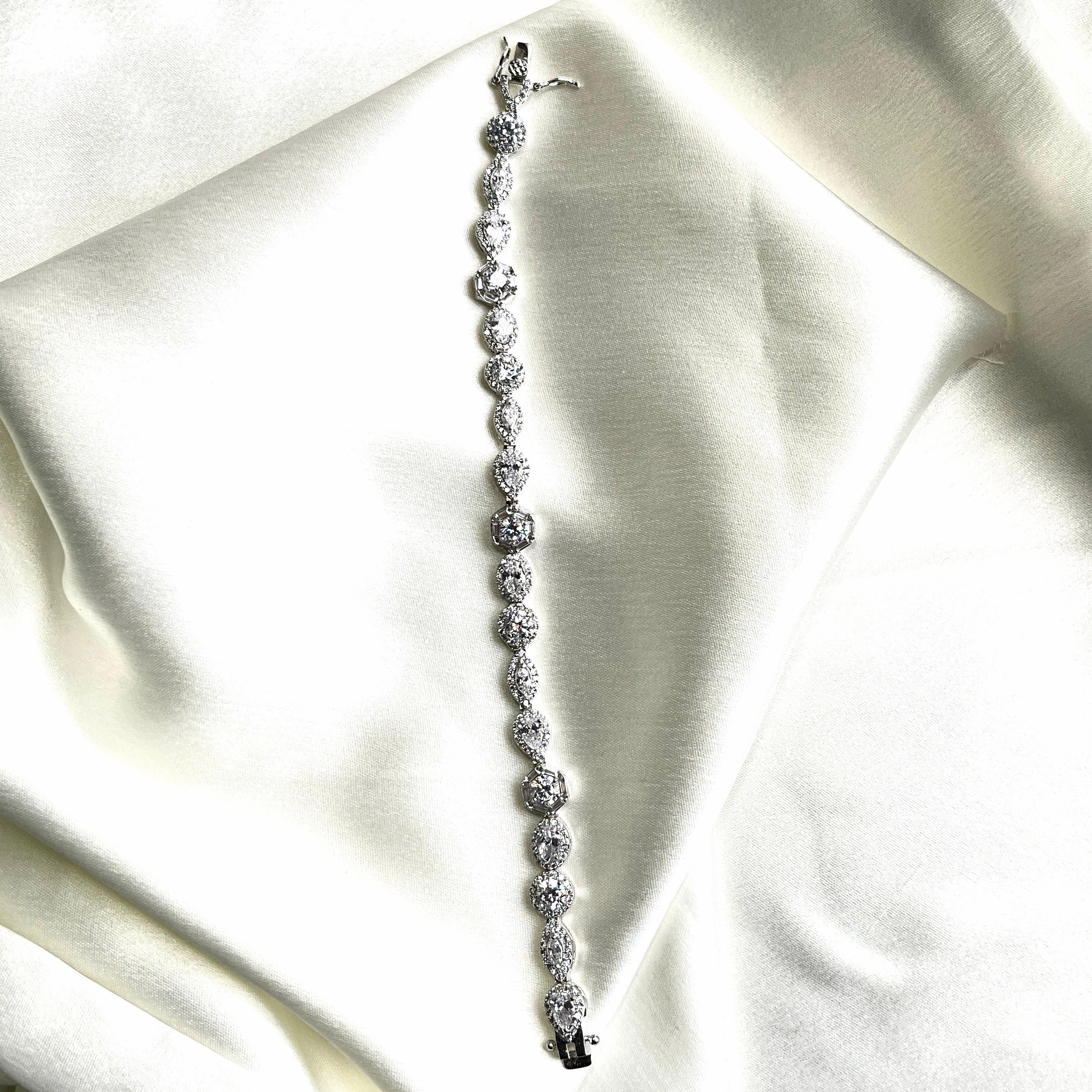 Unmissable Detail Persistent Amalgamations Rainbow crest tennis bracelet