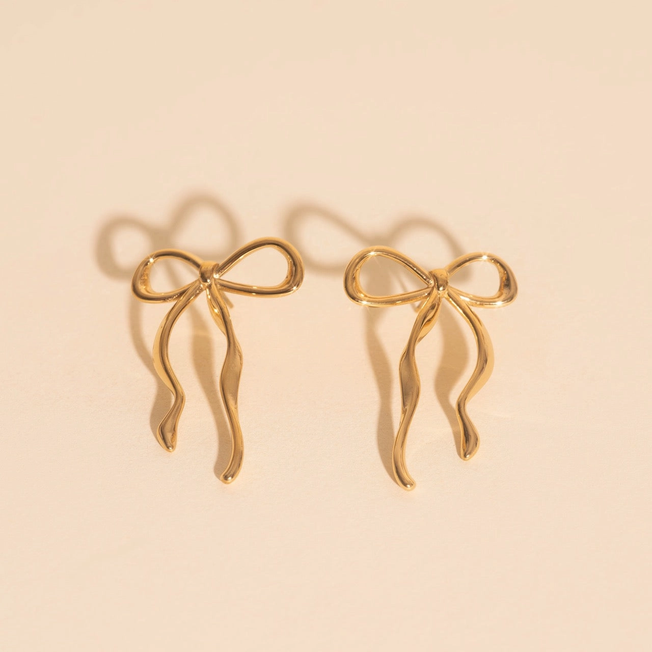 Fine finishing Glistening Accent Jumbo Bow Stud Earrings