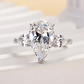 Superior Symbol Louily Gorgeous Pear Cut Three Stone Engagement Ring