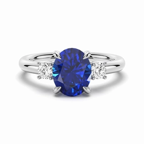 Fashionable Shine Sparkle Mood 2 CT. Oval Blue Sapphire and White Sapphire Three Stone Ring