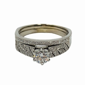 Silk Finish 0.89 ctw 14k white gold bridal set w/ a 0.58CT round center diamond and matching band